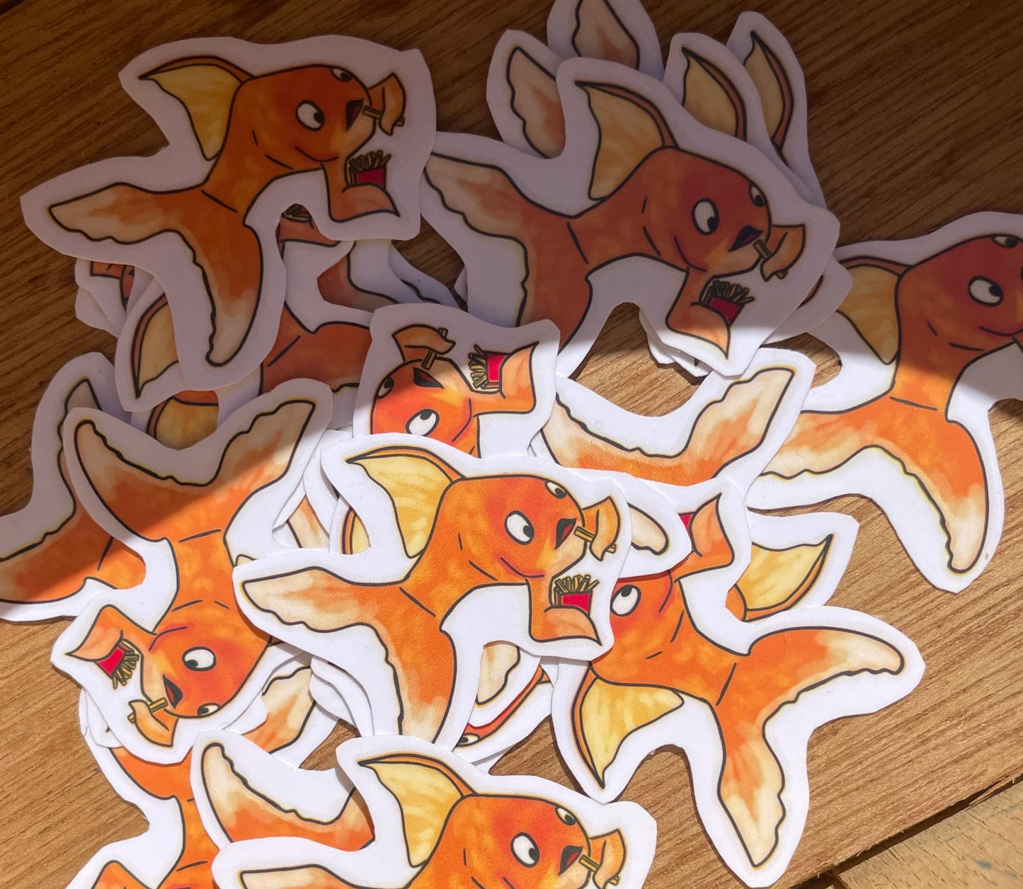 Adorable Gold Fish Snacking on French Fries Sticker