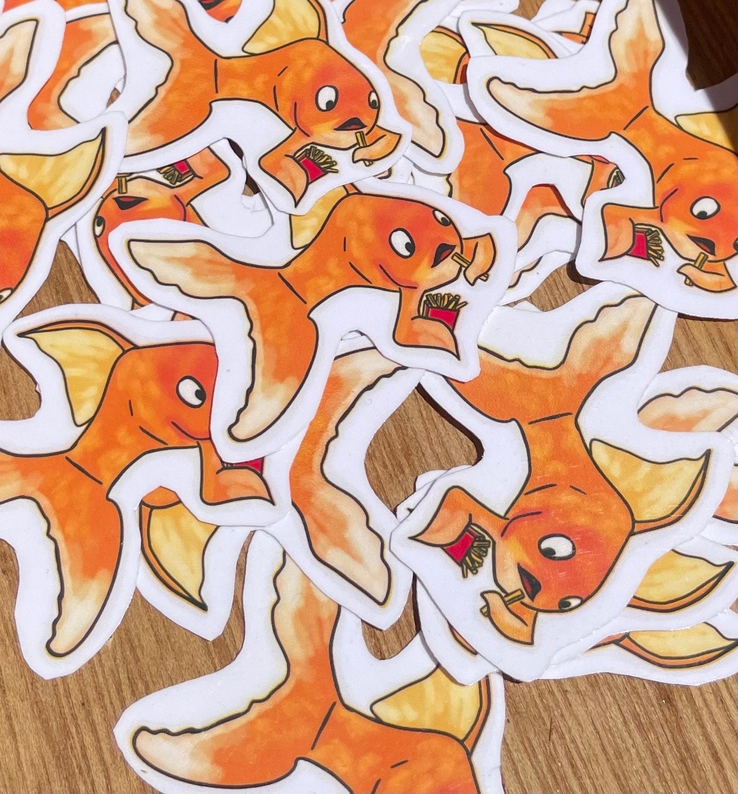 Adorable Gold Fish Snacking on French Fries Sticker