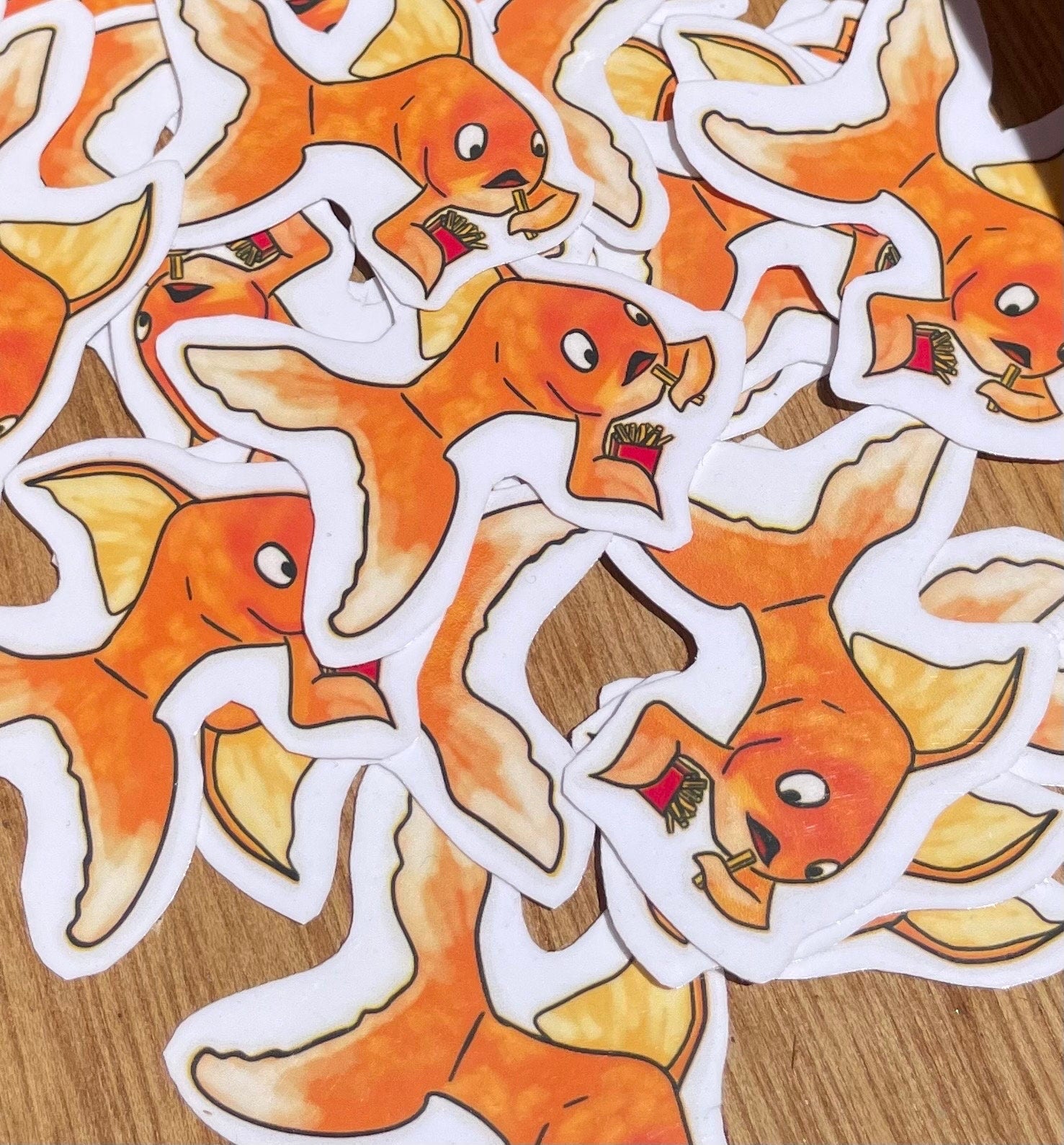 Adorable Gold Fish Snacking on French Fries Sticker