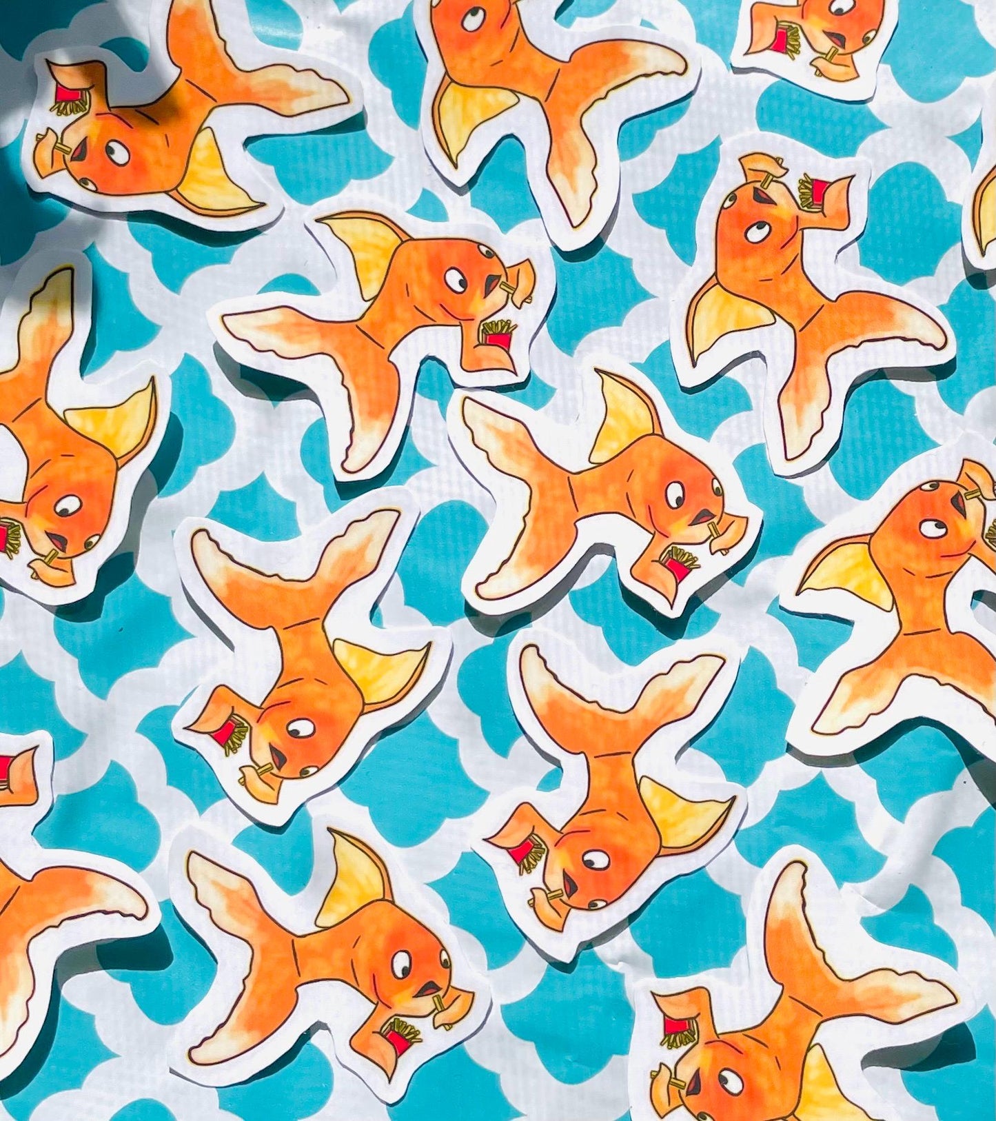 Adorable Gold Fish Snacking on French Fries Sticker